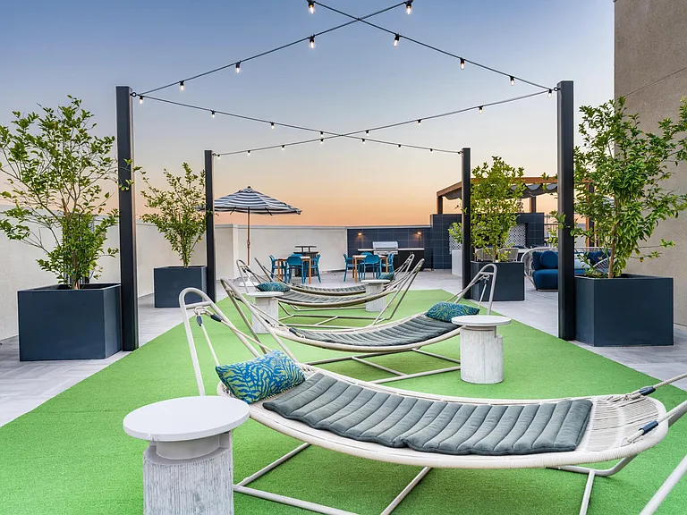 Rooftop deck seating at Modera Pomona offers stunning views, cozy vibes, and the perfect spot to unwind or entertain.