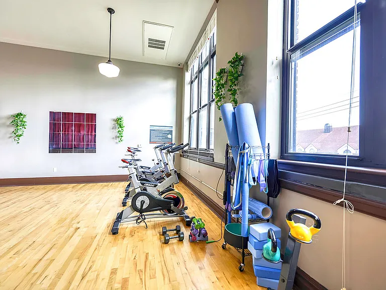 cycling and yoga area with hardwood floors,large windows West Hill KC