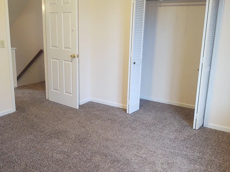 large closet in 2nd floor back bedroom.