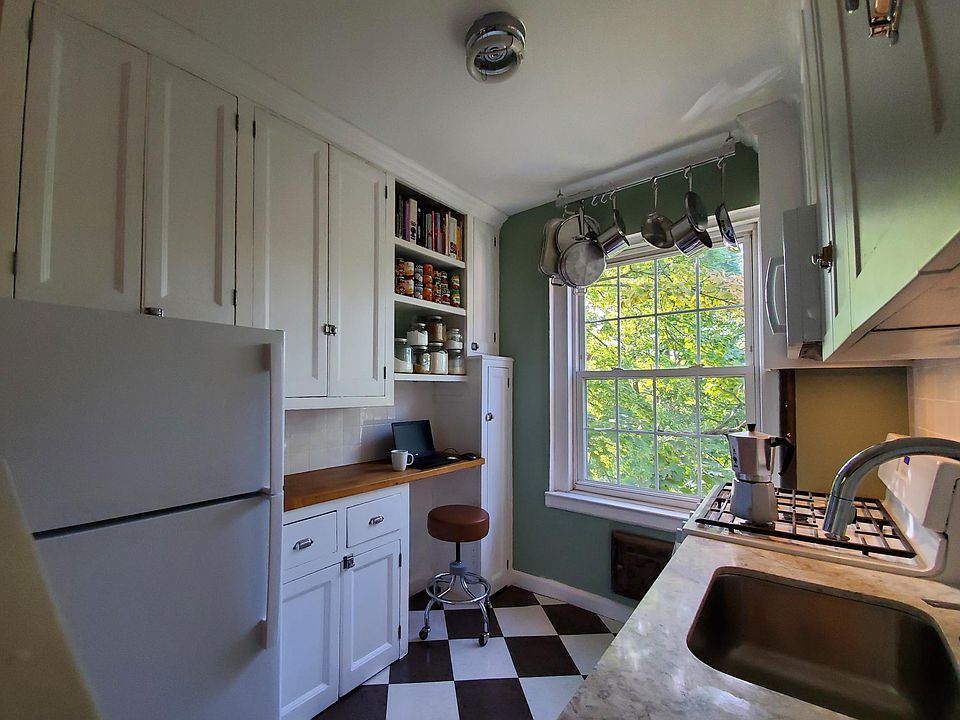 Open, adjustable shelves can be removed to use as home office.