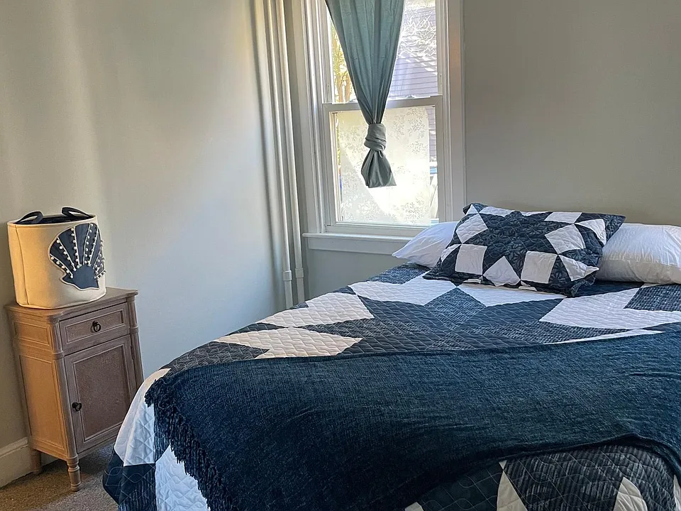 Bedroom #1.
Comfy queen bed, black out curtains, window tint on the lower windows and carpet.