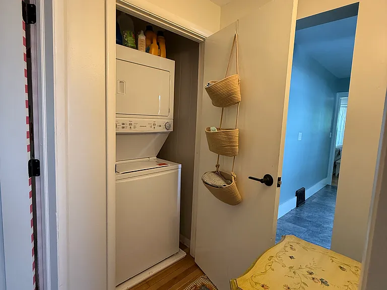 In-unit stack laundry is provided