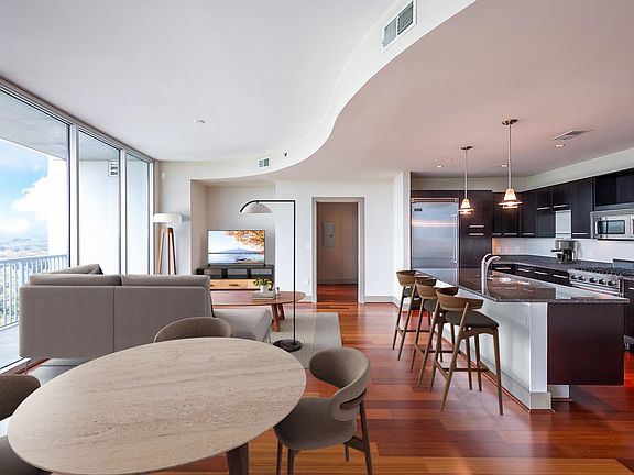 Spacious living room features floor-to-ceiling windows with amazing views of Buckhead