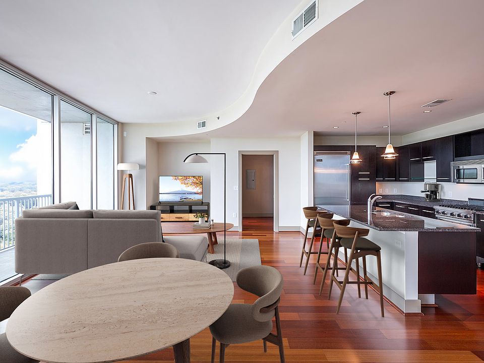 Spacious living room features floor-to-ceiling windows with amazing views of Buckhead