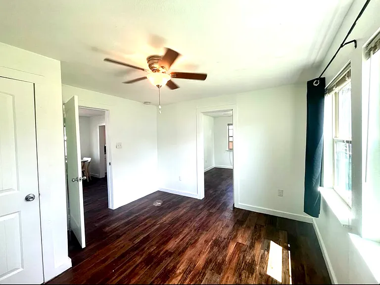 Secondary bedroom/office. To the left is the living room. The door on the right takes you into the primary bedroom