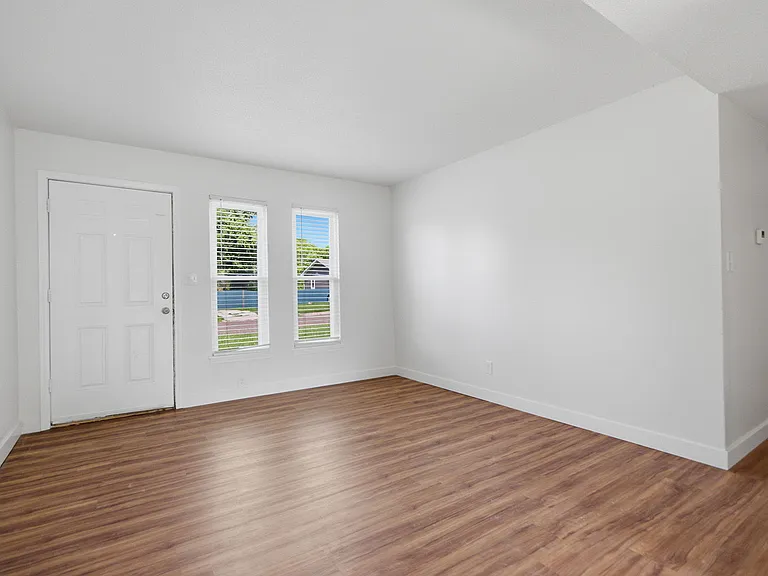Spacious living room with new flooring