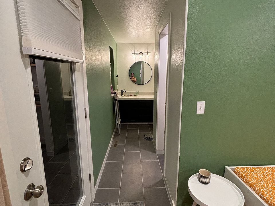 Tiled floor in bathroom, kitchen, and hallway.