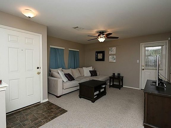 Spacious living area is open and functional. A powder room/half bath is ideal for guests.