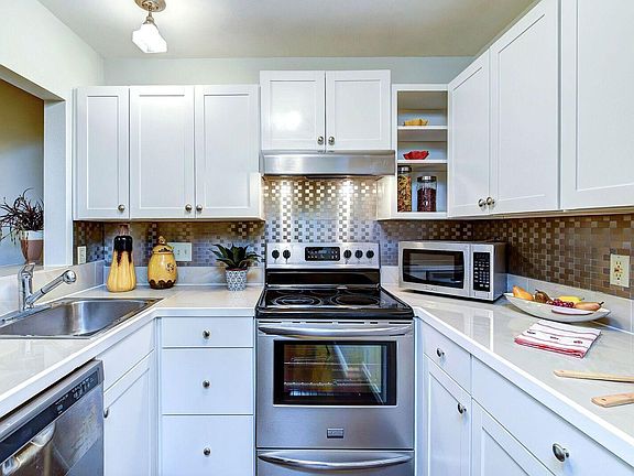 Kitchen overlooking sunny Dining room.