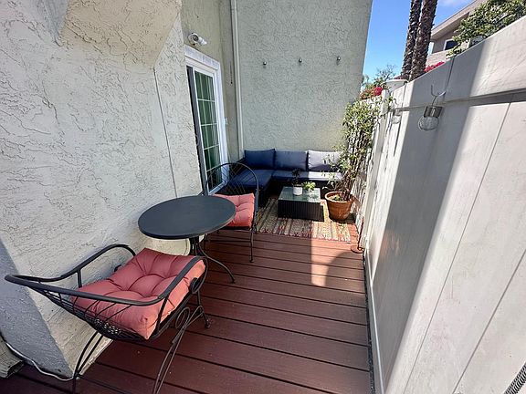 Outdoor patio with enough space for couch and table.