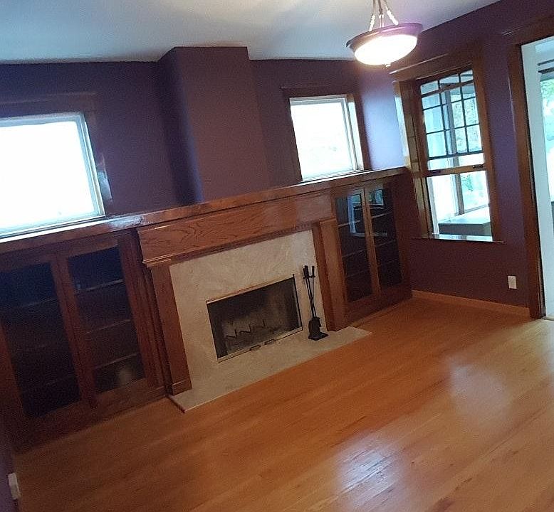 living room with wood burning fire place