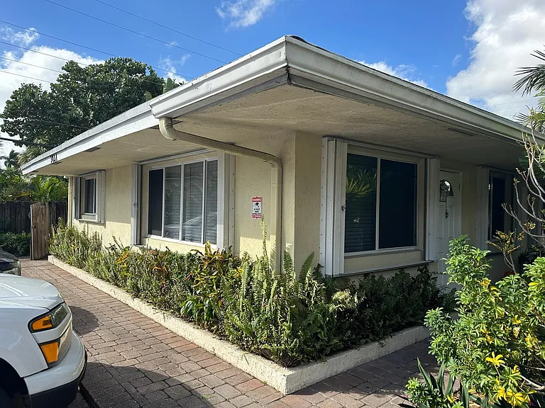 Your Unit #1 open to natural sunlight and breeze on 3 sides; this picture taken from Parking with your parking spot just steps from your front door