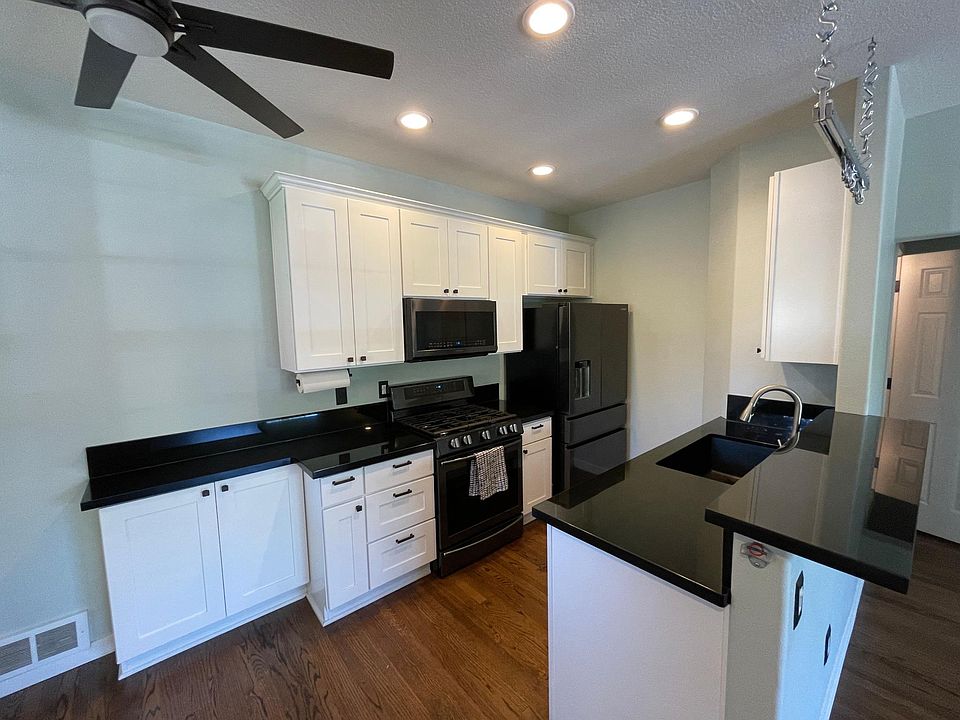completely updated kitchen with new cabinets, black granite, and appliances