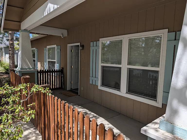 Fully fenced shady front porch