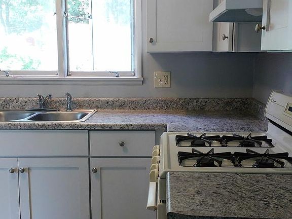 Kitchen - new cabinets, counter top, ceramic tile flooring