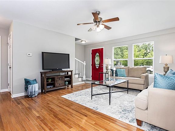 Original hardwood floors, beautifully preserved in the main living area.