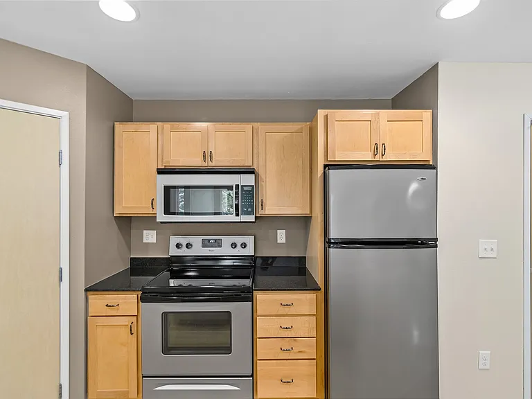 Elevate your lifestyle at Overlook Ridge with this stylish kitchen featuring modern appliances and sleek finishes. Ideal for culinary enthusiasts and social gatherings alike. Explore the perfect balance of comfort and eleganceschedule your visit today!