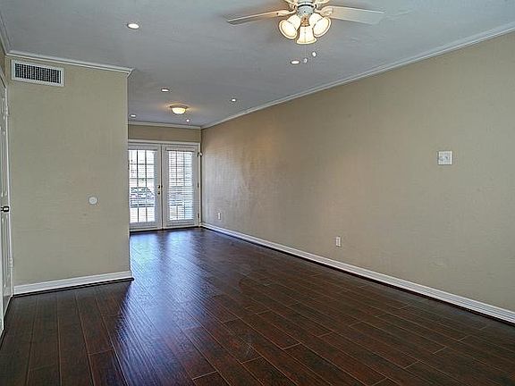 View of living area from the front entrance. Recessed lights