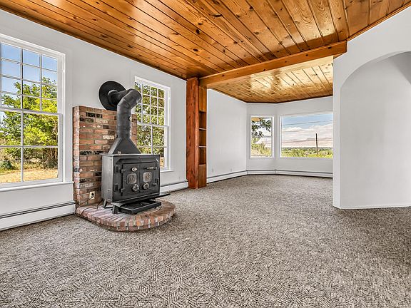 Living room w/wood-burning stove.