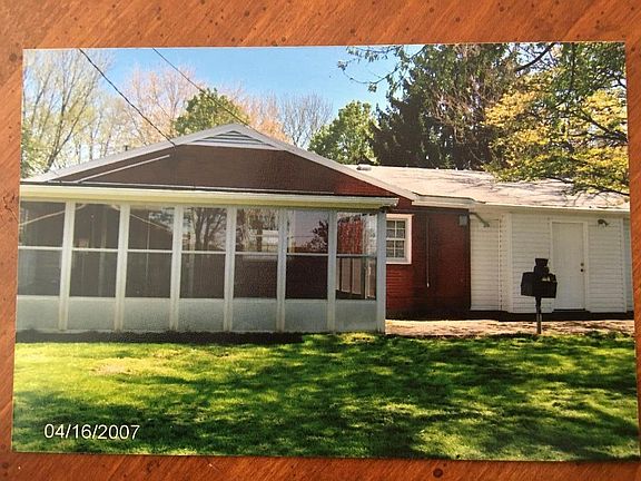 Back yard area sunroom and garage