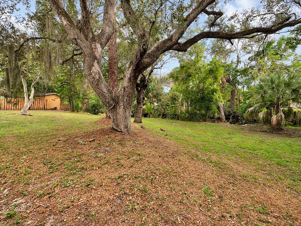 Sit and relax in the oversized yards with old heritage trees.