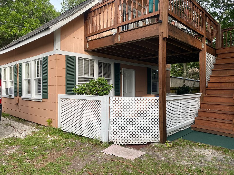 Duplex on large wooded lot two blocks from beach. Downstairs unit currently for rent. Private parking spot next to building.