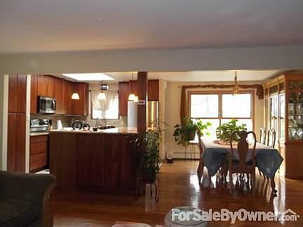 Kitchen & DR - view from living room
						:
						Gleaming hardwood floors and bright.