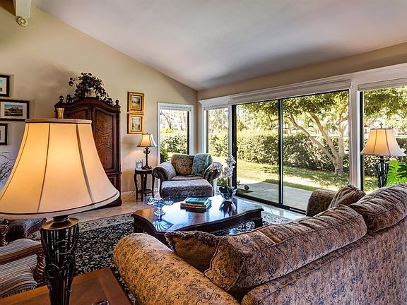 Living Room looking to rear yard and golf course beyond.