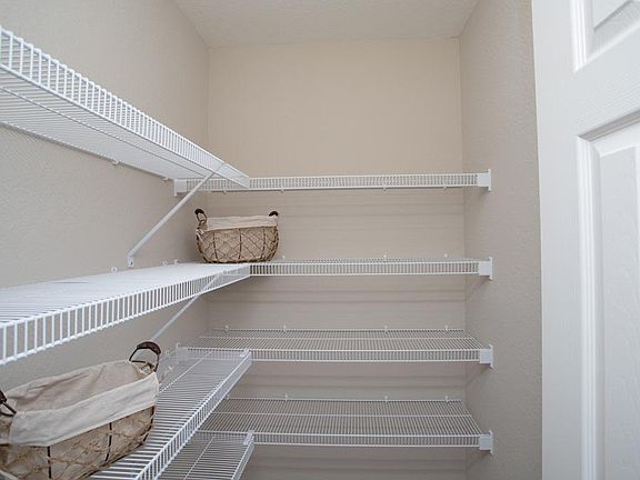 Large walk-in pantry for additional kitchen storage - New home for sale in Eagle Lake, FL. Photo sho