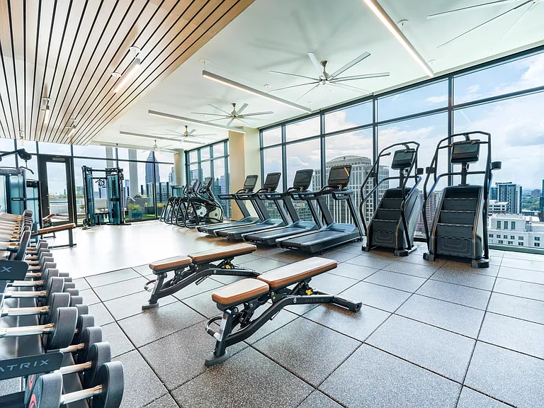 Our sunlit fitness center features expansive city views and modern equipment, keeping Midtown energy close to every workout.