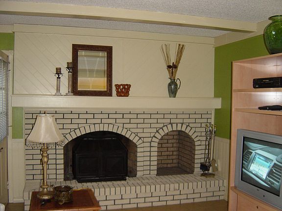 Family room with fireplace and wet bar.