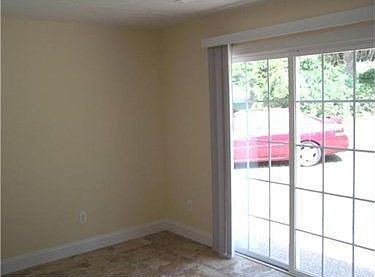 Alternate view of the dining room showing sliding door to the rear patio.