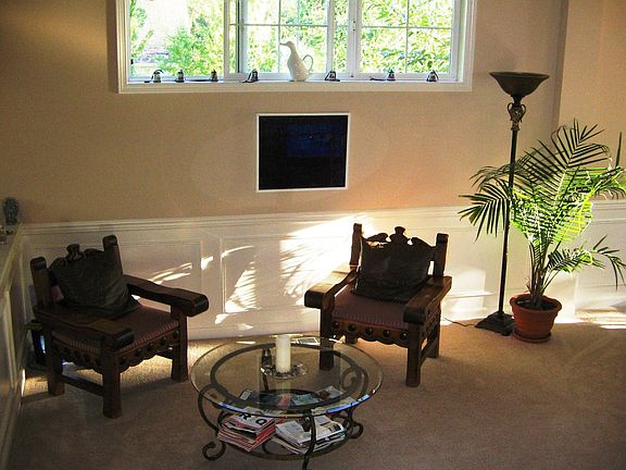 formal living room with cathedral ceiling
