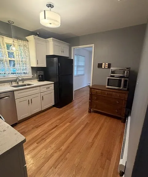 Kitchen with updated cabinets and quartz countertops.
