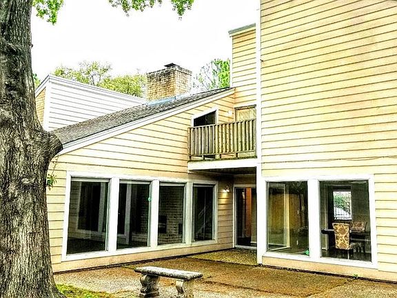 Amazing windows look out to private backyard.....with no neighbor looking back.  Second floor deck is off a library / study area!