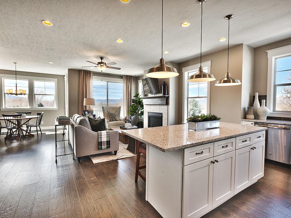 Large open living space on second floor includes this gorgeous kitchen, family area with a gas fireplace, and spacious dining nook.