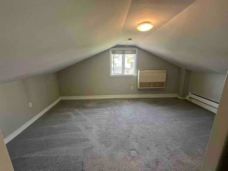 Rear bedroom has wall AC to cool upstairs