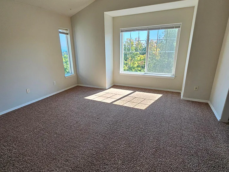 Primary bedroom with attached bathroom