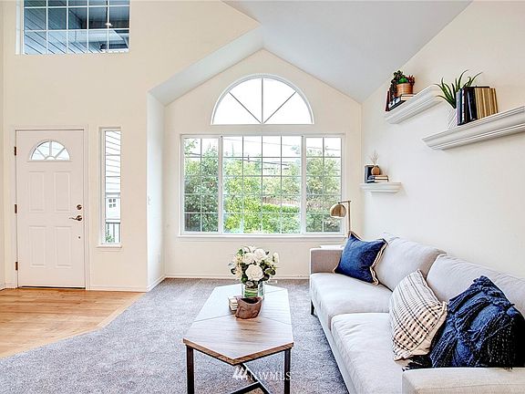Windows placed throughout home to capture light, create space! Interesting shapes of ceiling create drama!