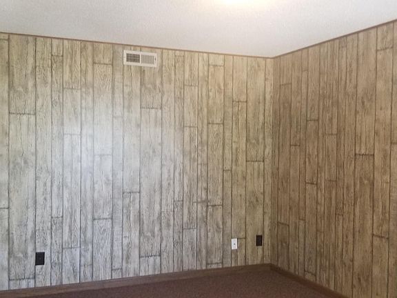 Living room with gray wood grain.