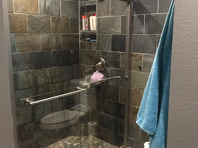 En suite bathroom has dual shower heads