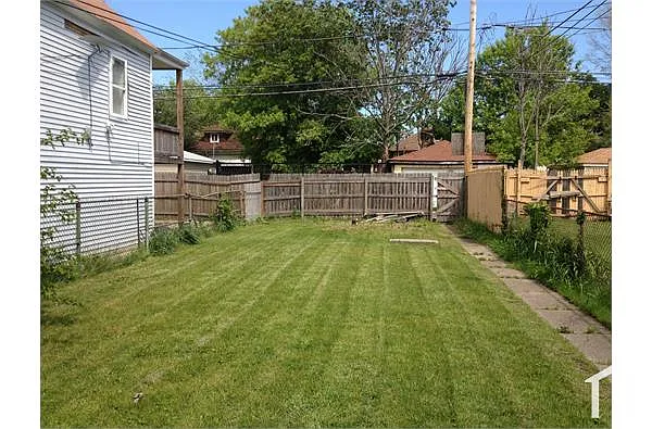 Building Photo - 8737 S Colfax Ave #1