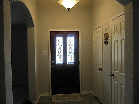 FOYER OFFERS CERAMIC TILE. 2 CLOSETS FOR STORAGE & BEAUTIFULWOOD & BEVELED GLASS FRONT DOOR