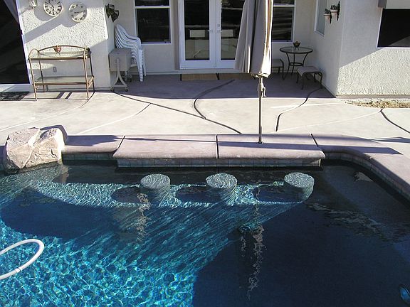 Bar stools in the pool