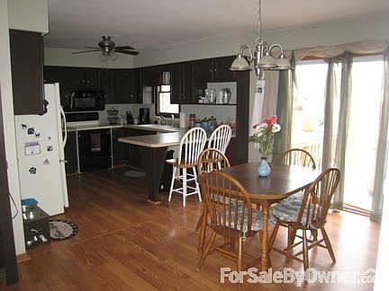 Kitchen
						:
						Kitchen with attached dining area, sliding doors to deck and yard