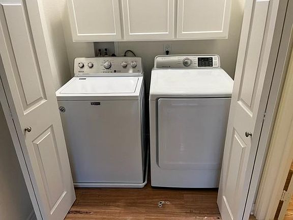 In unit washer and dryer with storage.