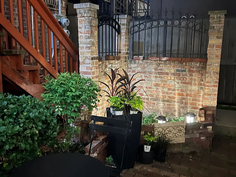 nighttime charm in the private courtyard surrounded by vintage brick