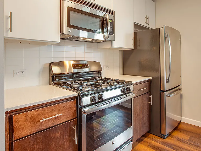 Spacious kitchens with wood flooring throughout