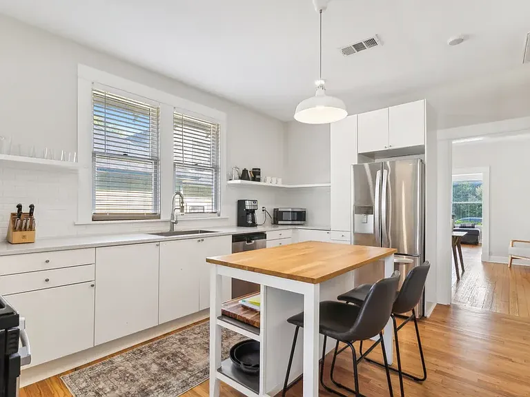 Kitchen with view back into dining room