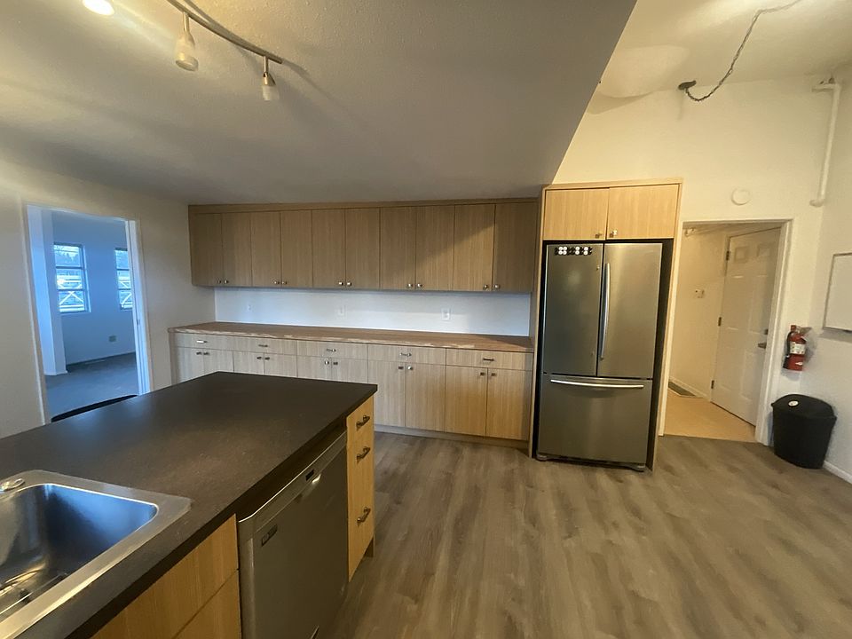 Kitchen facing the entryway and dining room